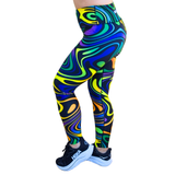 Colourful patterned swirl leggings worn by a person on a white background