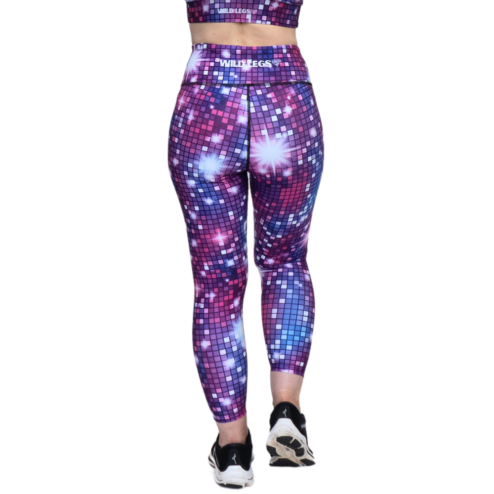 Person wearing a colorful disco ball pattern leggings on a white background