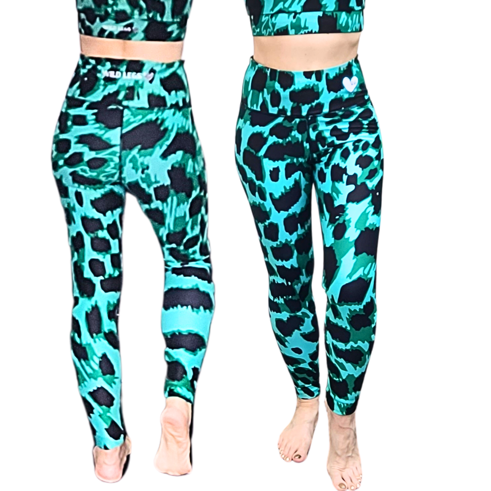 Front and back view of women wearing Wild Legs Emerald Leopard leggings, featuring a vibrant emerald green base with bold black leopard print, high-waisted fit, and matching sports bra