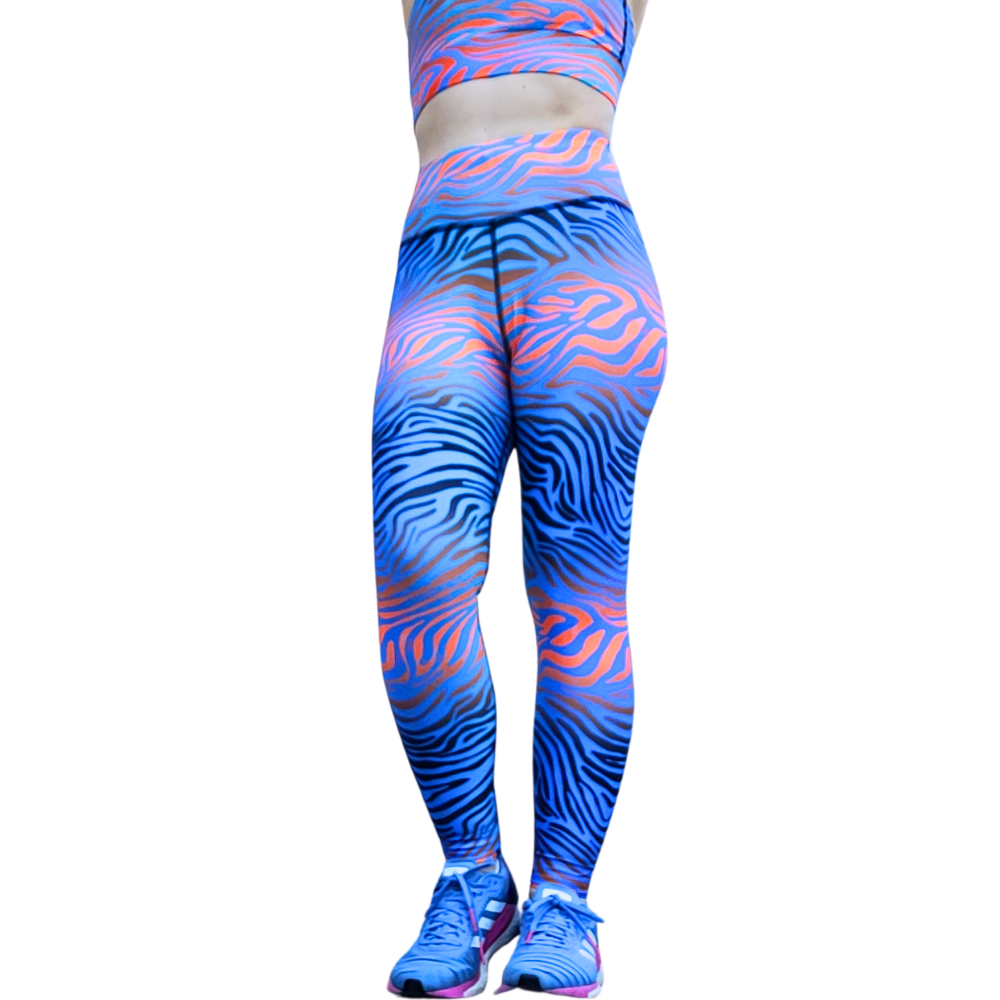 Blue and flaming orange tiger pattern leggings on a white background