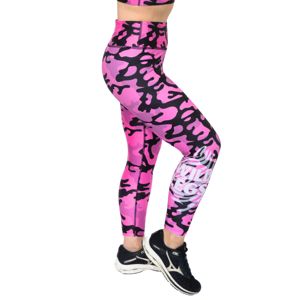 Pink camouflage leggings worn by a person on a white background
