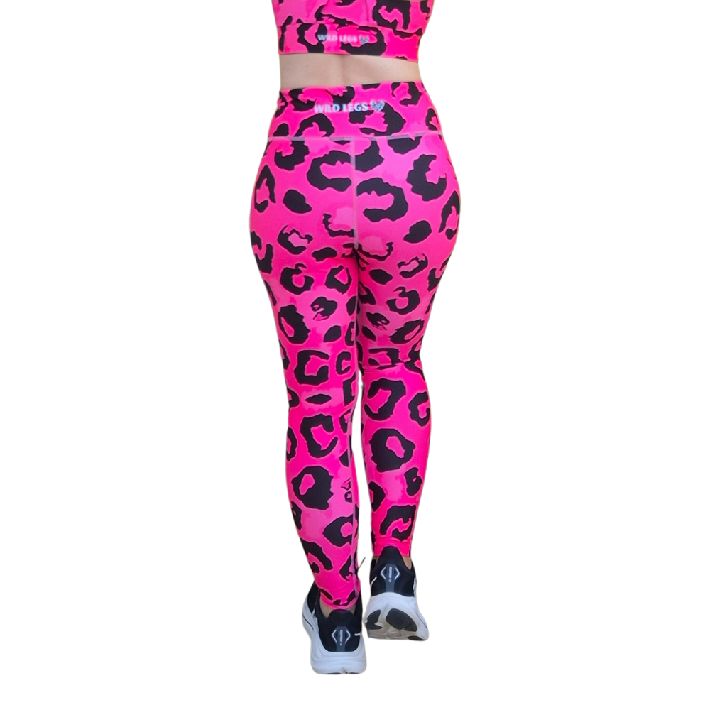 Neon Pink leopard print leggings with a matching top on a white background