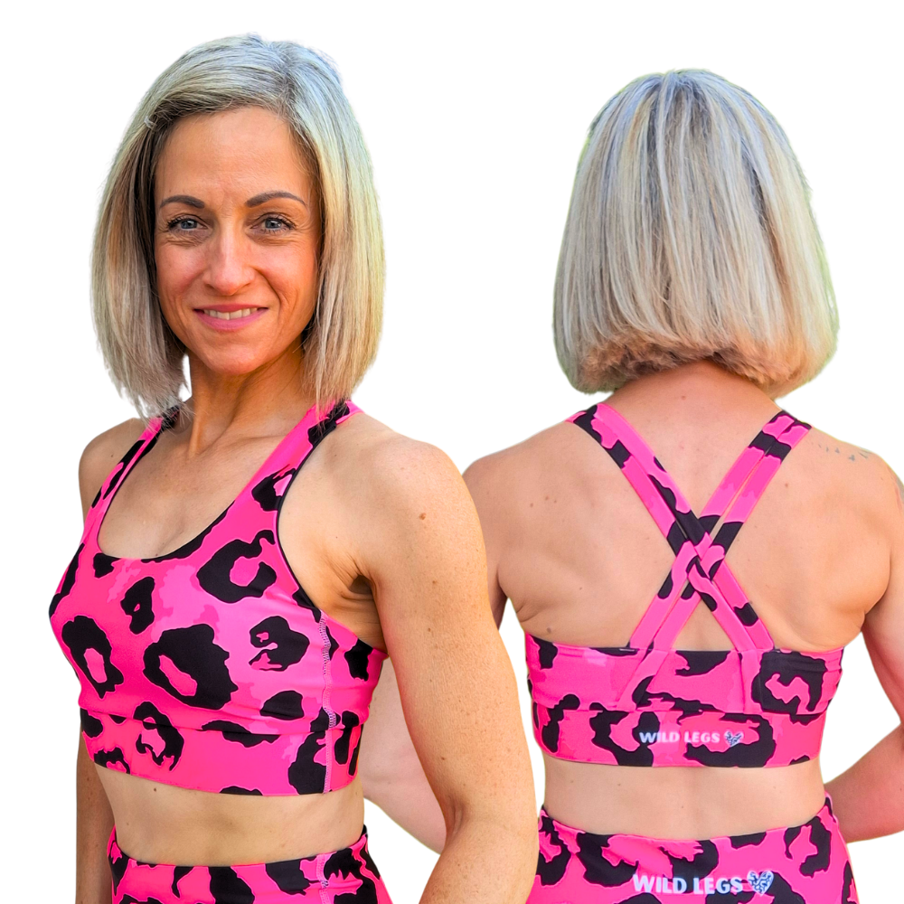 woman wearing pink and black leopard print sports bra, showing front and back view with Wild Legs branding