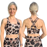 Woman wearing a patterned sports bra and leggings set, showing front and back views.