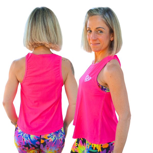 Woman wearing a bright pink sleeveless top with a logo and colorful tie-dye leggings, shown from front and back.
