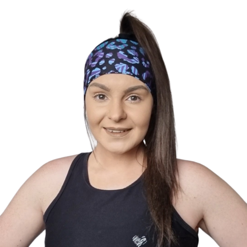 Woman wearing animal print headband and a black top on a white backgroud