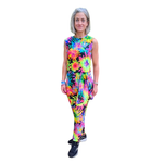 Person wearing a colourful floral jumpsuit on a white background