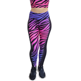 Zebra print leggings with pink and purple gradient on a white background