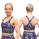 Woman wearing a colorful sports bra and leggings set, showing front and back views.