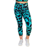 Emerald Green and black leopard print leggings worn by a person on a white background