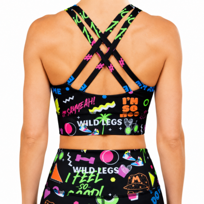 Black sports bra and shorts set with colourful text and 90s vibe graphics on a white background
