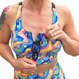 Front fastening colourful sports bra with hooks on a white background