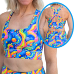 Colorful sports bra and shorts set with a rainbow pattern on a white background