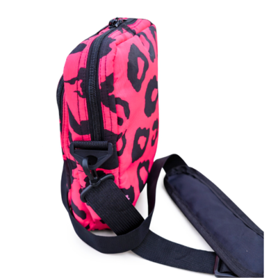 Pink and black leopard print sling bag on a white background