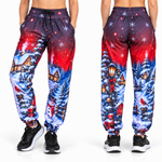 Christmas Joggers shown from the front and back with a festive snowy scene worn with black trainers on a white background