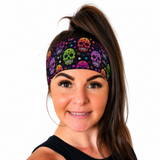 Sugar Skulls design headband in bright neon colours on a woman with a high ponytail on a white background