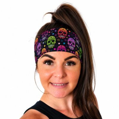 Sugar Skulls design headband in bright neon colours on a woman with a high ponytail on a white background