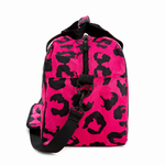 Pink with black leopard print pattern holdall from the side view on a white background