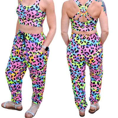 Two views of a colorful leopard print outfit with a crop top and pants.