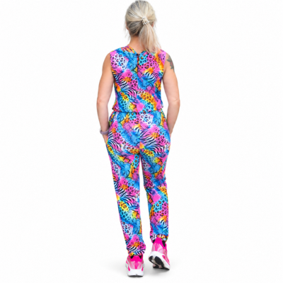 A woman viewed from behind wearing a sleeveless jumpsuit set with a bright multicolour animal print, set against a plain white background.