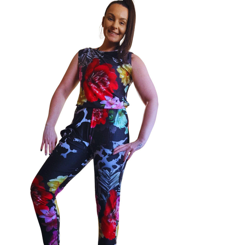 Woman wearing a colorful floral outfit on a white background