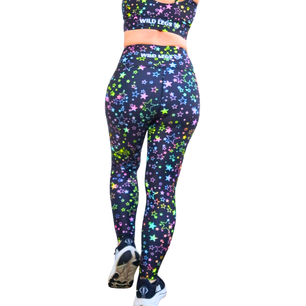 Multicolored star-patterned leggings with a matching top on a white background