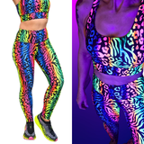 Colorful zebra print sports bra and leggings set under black light.