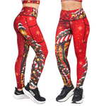 Red Christmas Fitness Leggings shown from two angles with Candy Canes, Christmas shop fronts, snow flakes, lanterns and snowy tress with black shoes on a white background