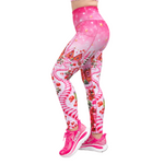 Christmas leggings in pink, with candy canes, shown from the side with pink shoes