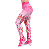 Christmas leggings in pink, with candy canes, shown from the side with pink shoes