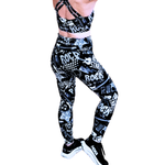 Black and white patterned leggings with 'Rock' text on a white background