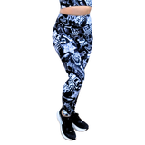 Black and white patterned leggings worn by a person on a white background