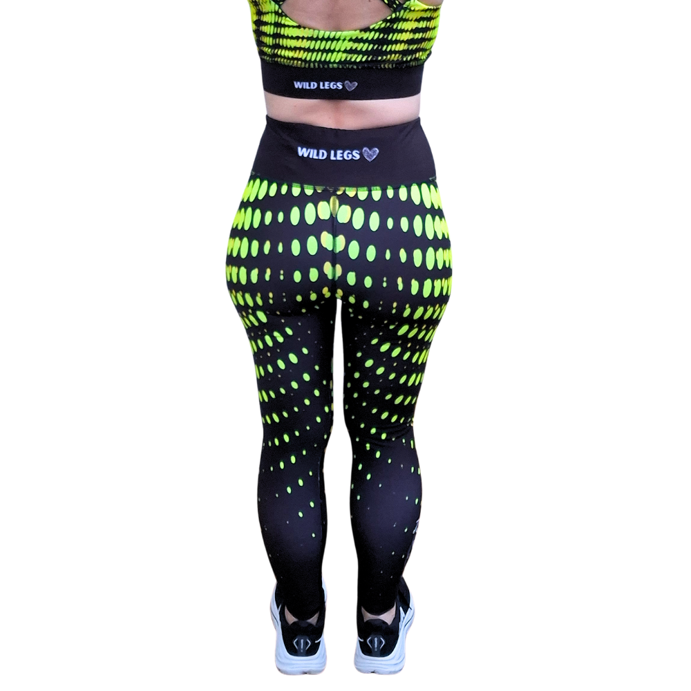 Black leggings with neon yellow pattern and 'Wild Legs' branding on a white background