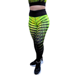 Neon yellow and black patterned leggings worn by a person on a white background