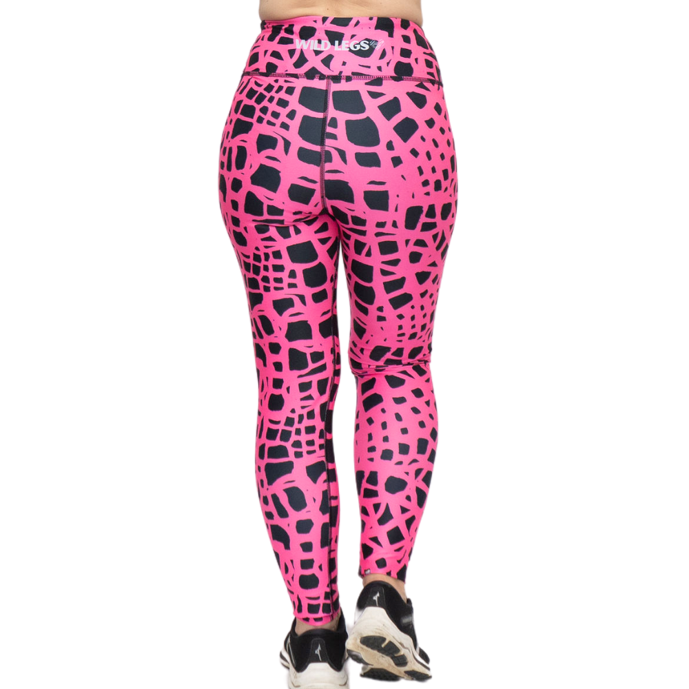 Pink and black patterned leggings with a visible brand logo on a white background