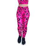 Neon Pink leopard print leggings with black shoes on a white background