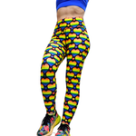Leggings with rainbow heart pattern worn by a person on a white background