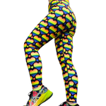 Leggings with rainbow heart pattern worn by a person on a white background