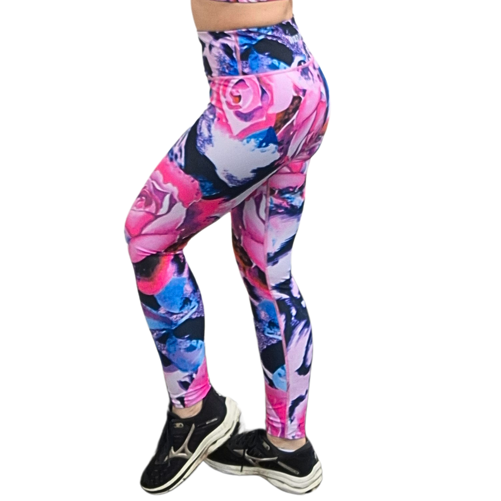 Colorful floral leggings worn by a person on a white background