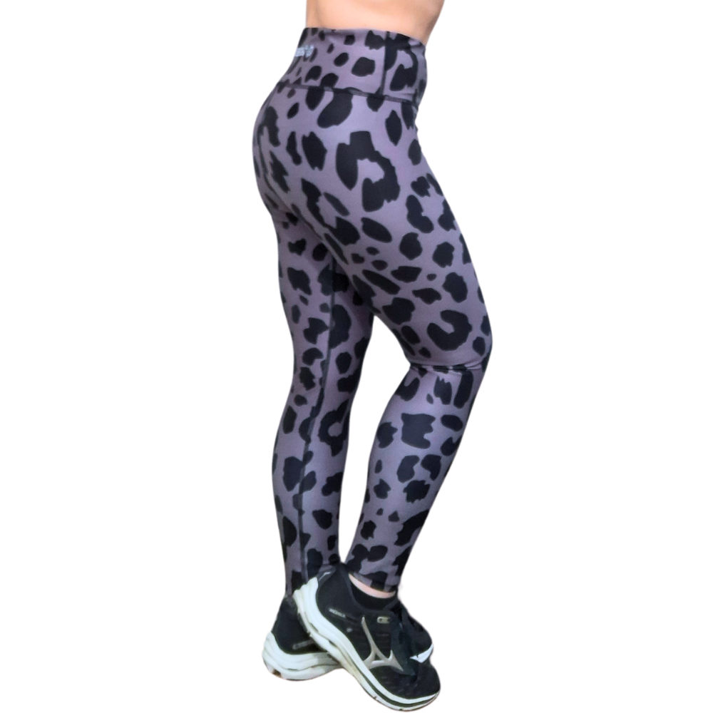 Gray and Black leopard print leggings worn by a person on a white background