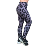 Gray and Black leopard print leggings worn by a person on a white background