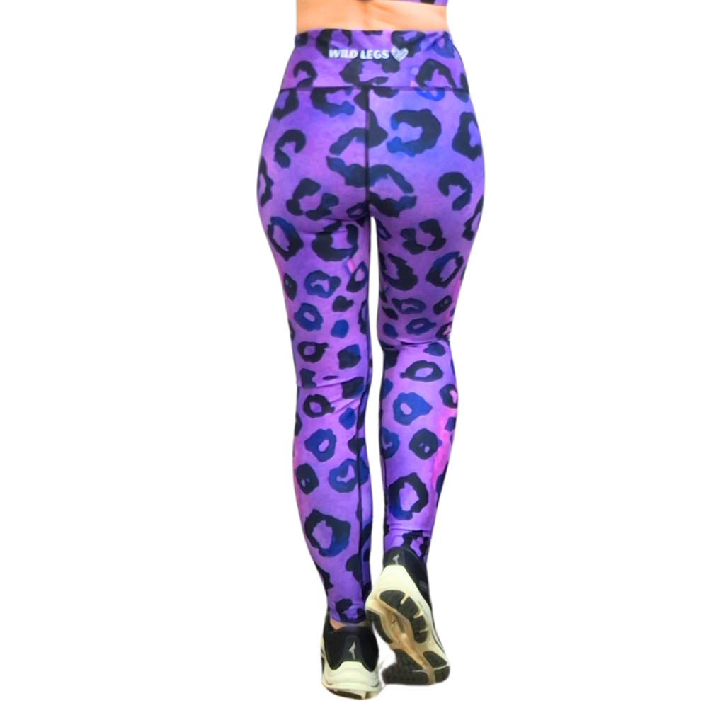 Purple and black leopard print leggings on a white background from the back