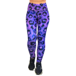 Purple and black leopard print leggings worn by a person on white background