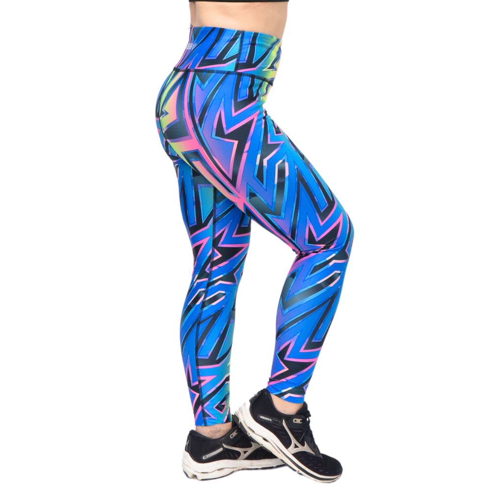 Colorful geometric-patterned leggings worn by a person on a white background