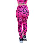 Neon Pink leopard print leggings with a matching top on a white background