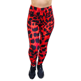 Red leggings with black leopard print pattern on a white background