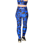 Blue and black leopard print patterned leggings with a matching top on a white background