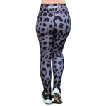Gray and Black leopard print leggings worn by a person on a white background