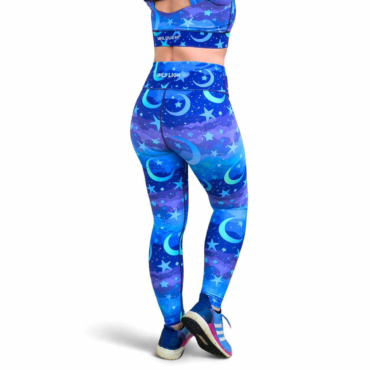 Blue and purple athletic outfit with celestial pattern on a white background