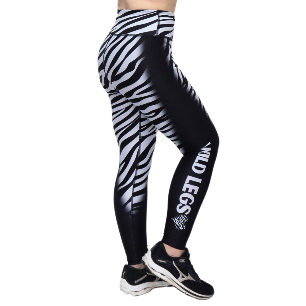 Black and white zebra print leggings with 'Wild Legs' text on a white background